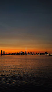 a city skyline at sunset