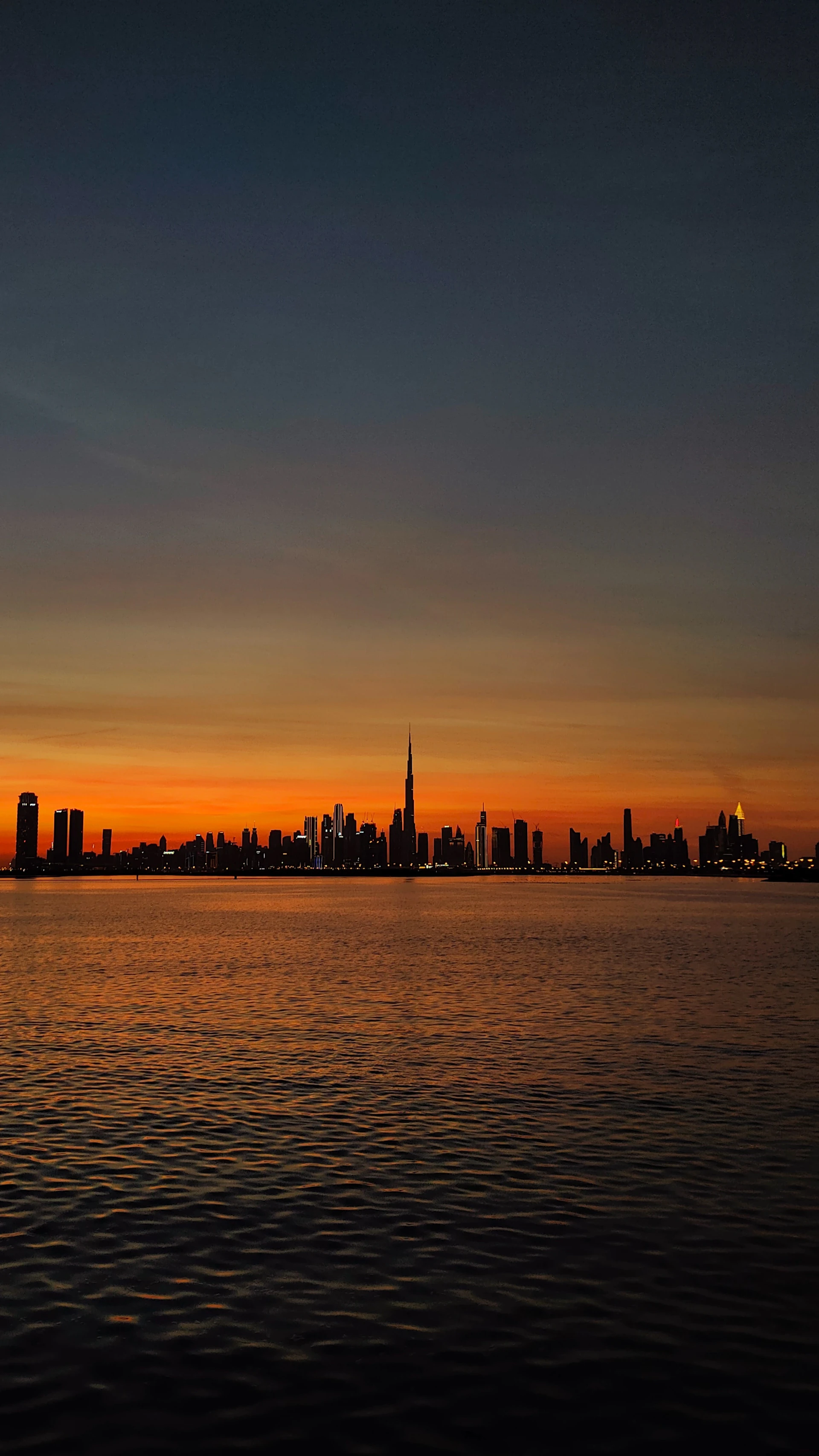 a city skyline at sunset