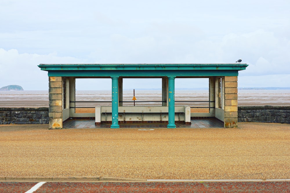 a large wooden structure with a bench