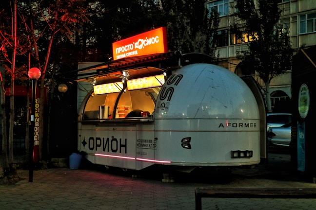 A sleek, modern food cart designed and printed with eye-catching graphics.