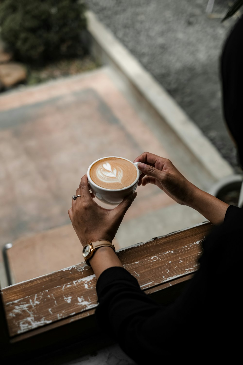 a person holding a cup