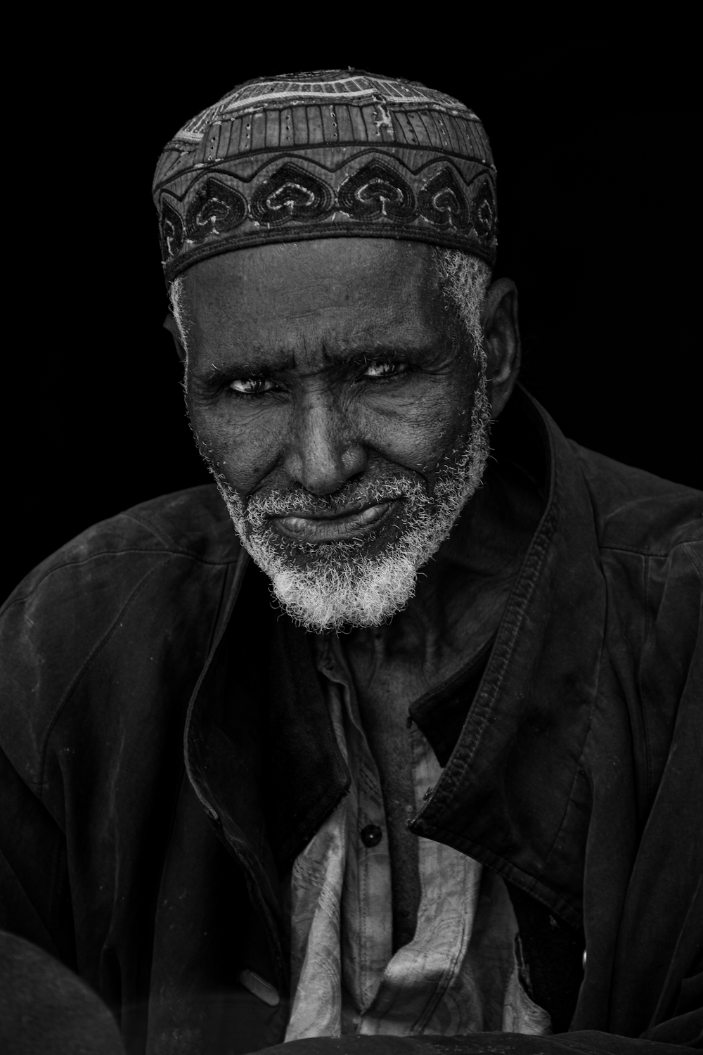 a man with a beard and a hat