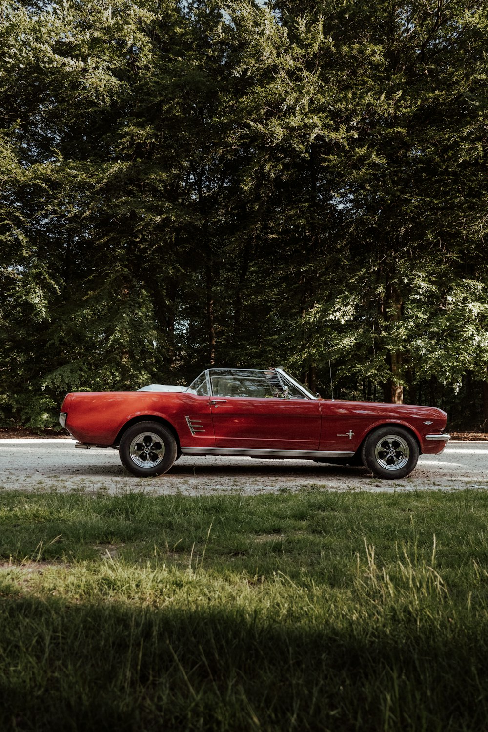 a red car parked on a road