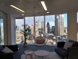 Elegant workspace with large window overlooking the city skyline.