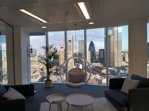 Elegant workspace with large window overlooking the city skyline.