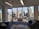 A modern office space with large windows and a city view.