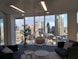 A modern office space with a view of a city skyline, symbolizing innovation and growth.