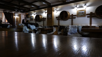 A cozy cantina interior with worn wooden furniture and dim lighting.