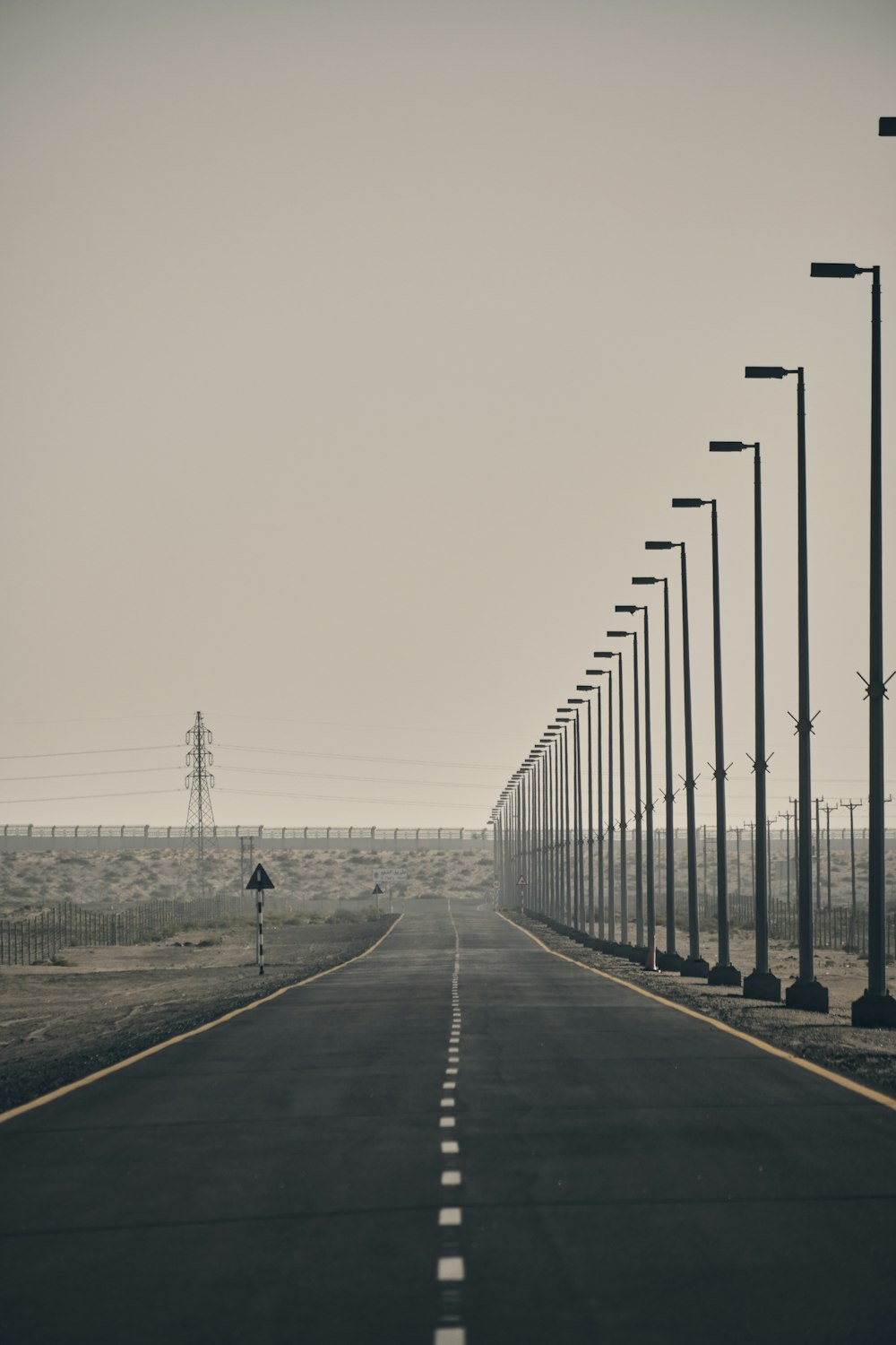 a road with street lights on the side