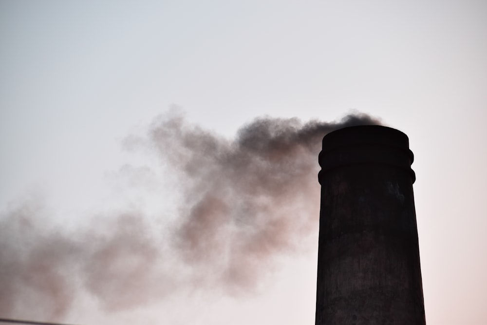 a tall chimney with smoke coming out of it