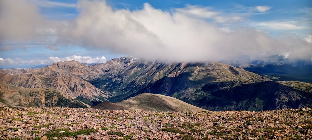 a landscape with mountains in the back