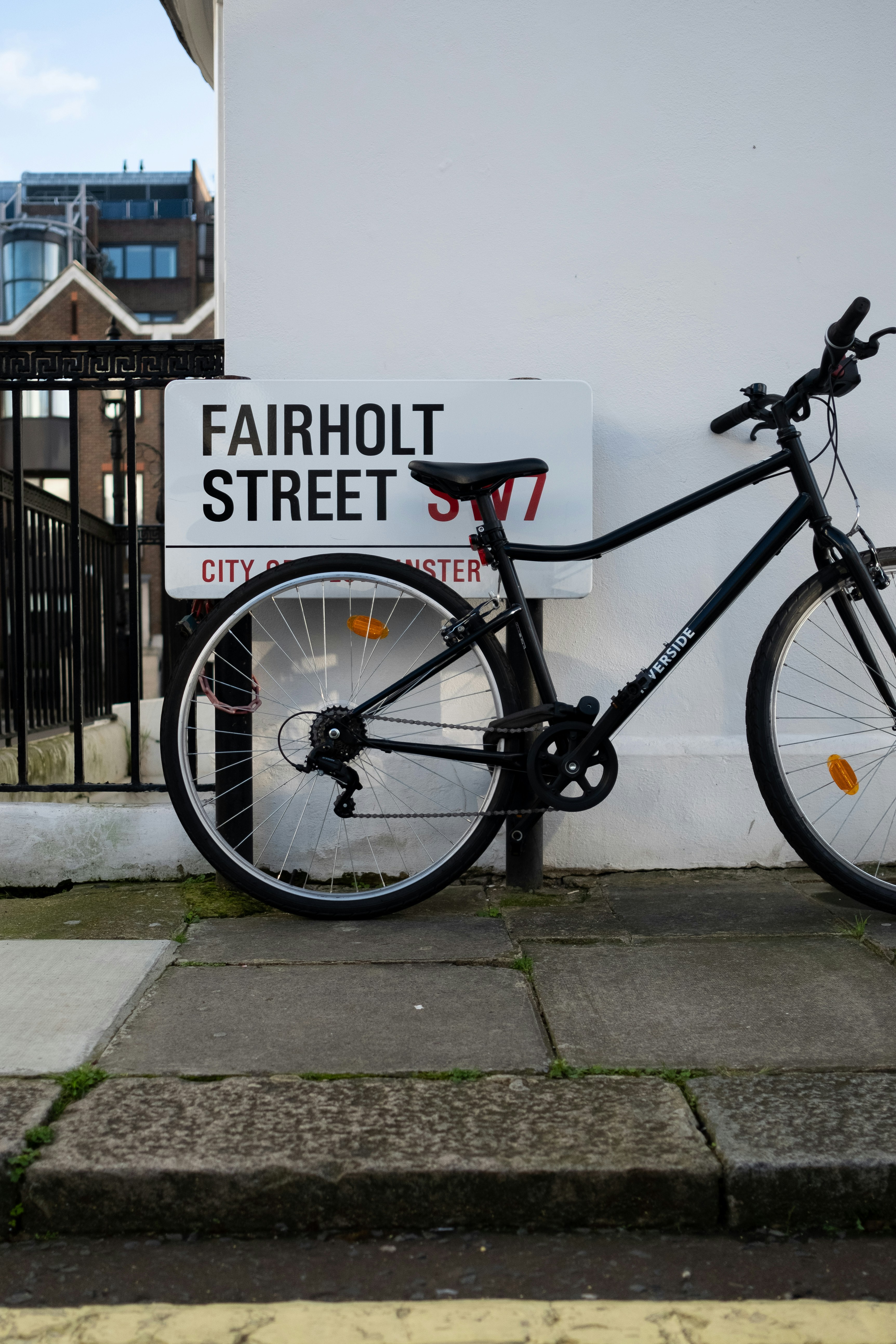 a bicycle parked on a sidewalk