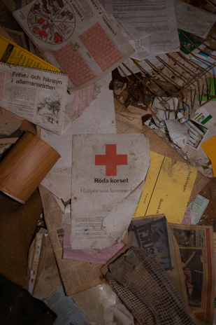 A collection of printed missing person flyers laid out on a wooden table, ready for distribution.