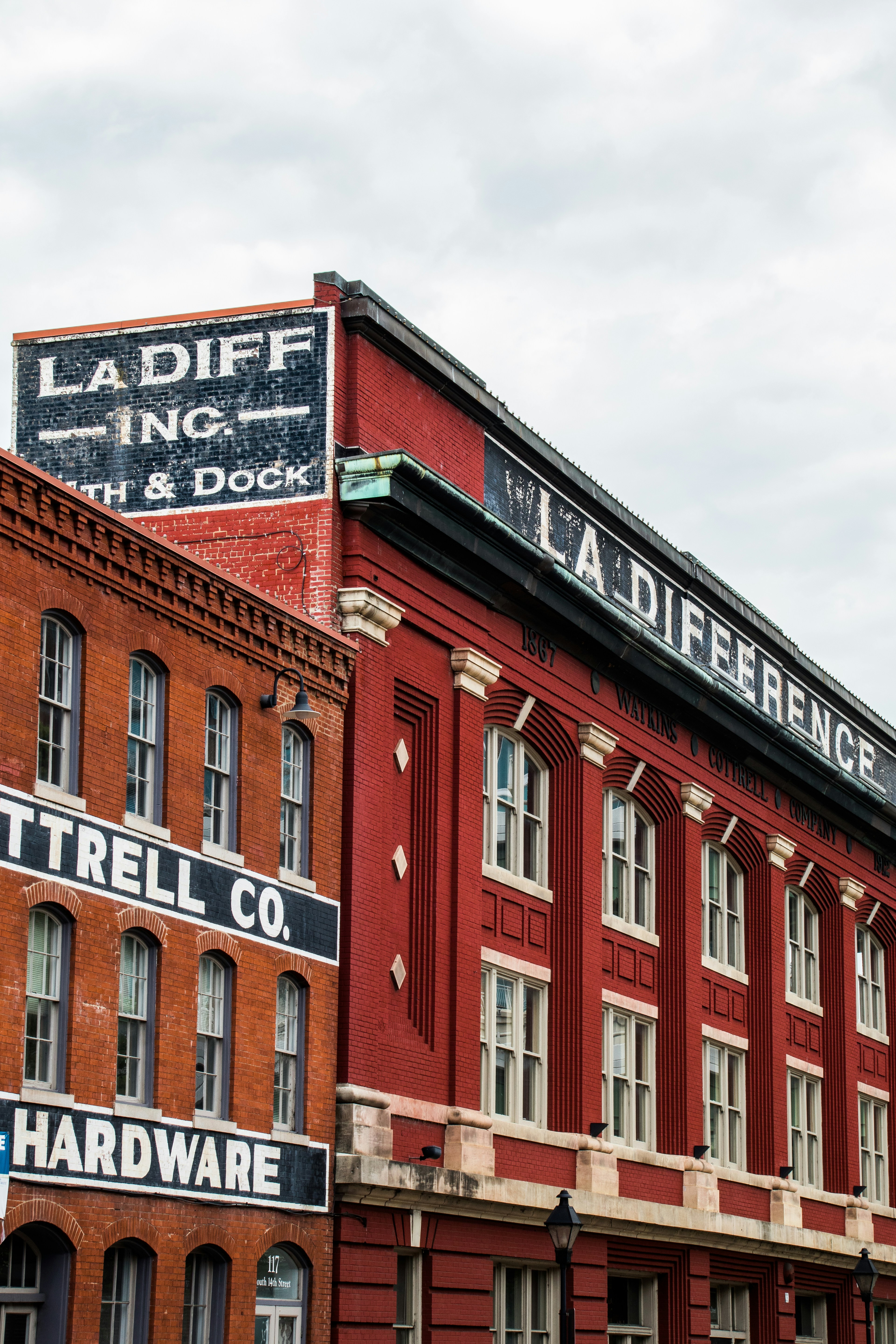 a large brick building with signs on it