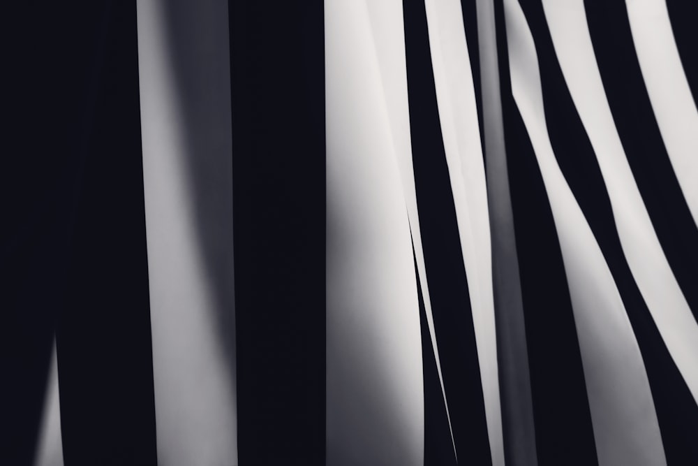 a close up of a black and white striped wall
