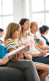 a group of students sitting in a classroom