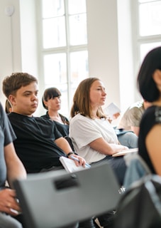 a group of people sitting in a room