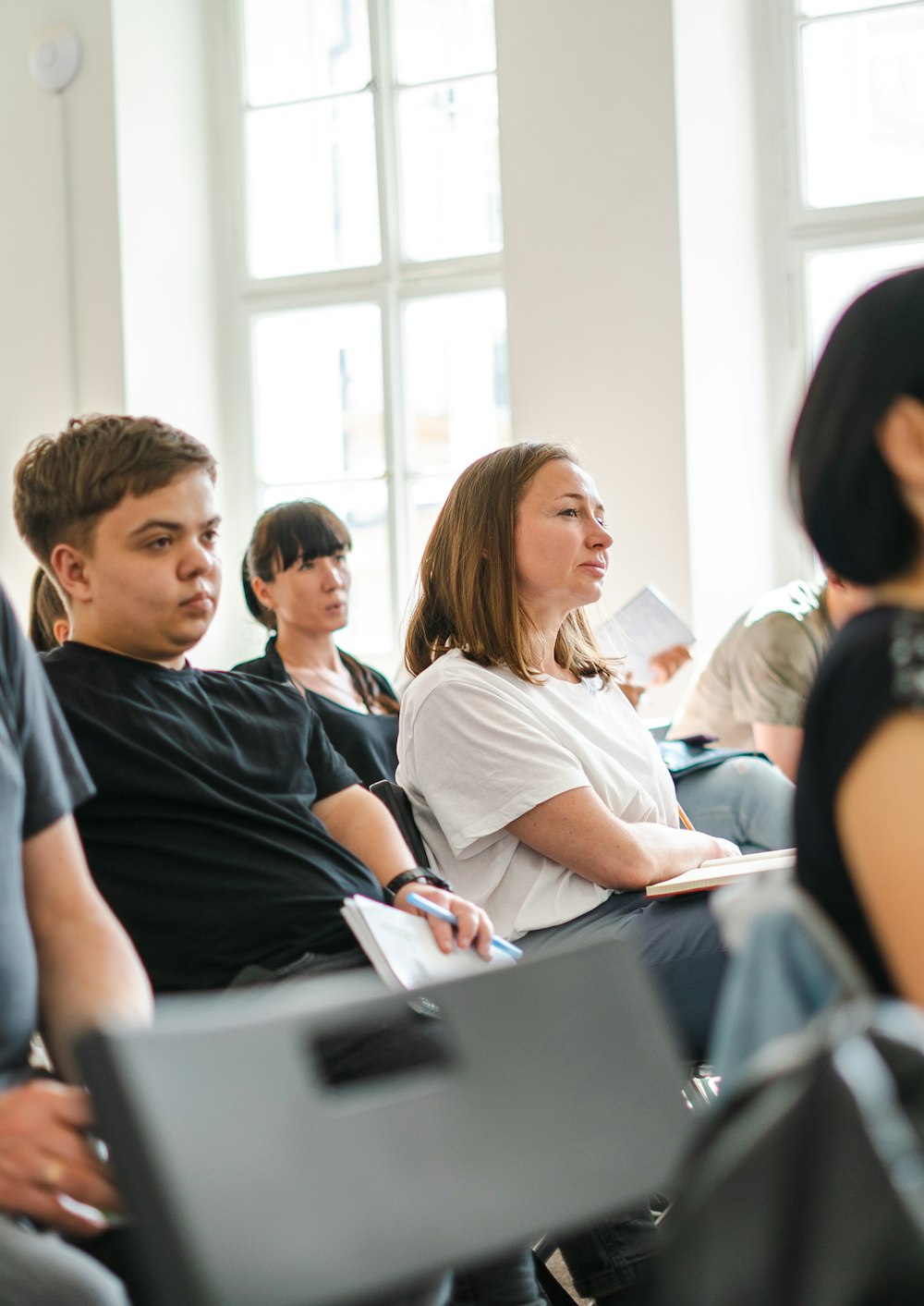 a group of people sitting in a room