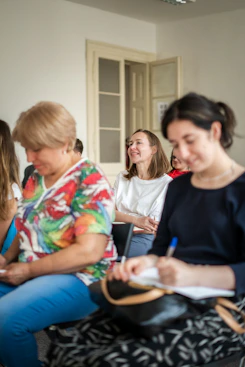 a group of women sitting in a room
