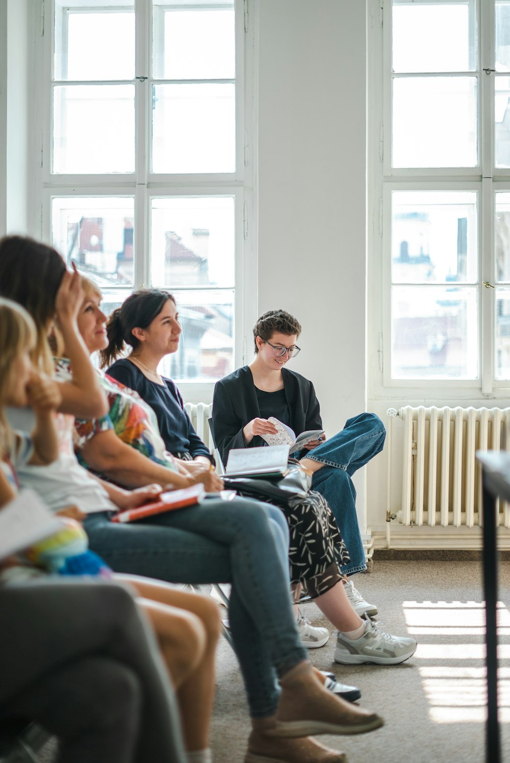 a group of people sitting in a room