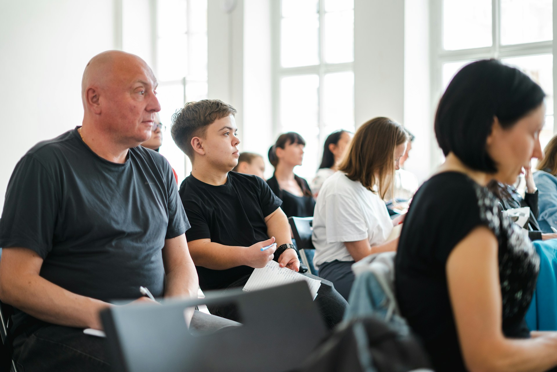 a group of people sitting in a room