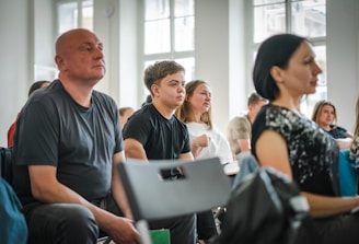 a group of people sitting in a room