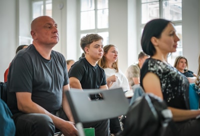 a group of people sitting in a room