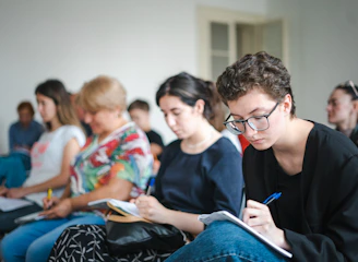 A focused adult learner participating in a hands-on finance seminar.