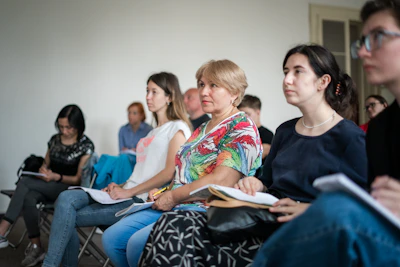 a group of people sitting in chairs