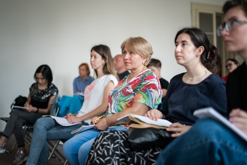 a group of people sitting in chairs
