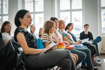 a group of people sitting in a room