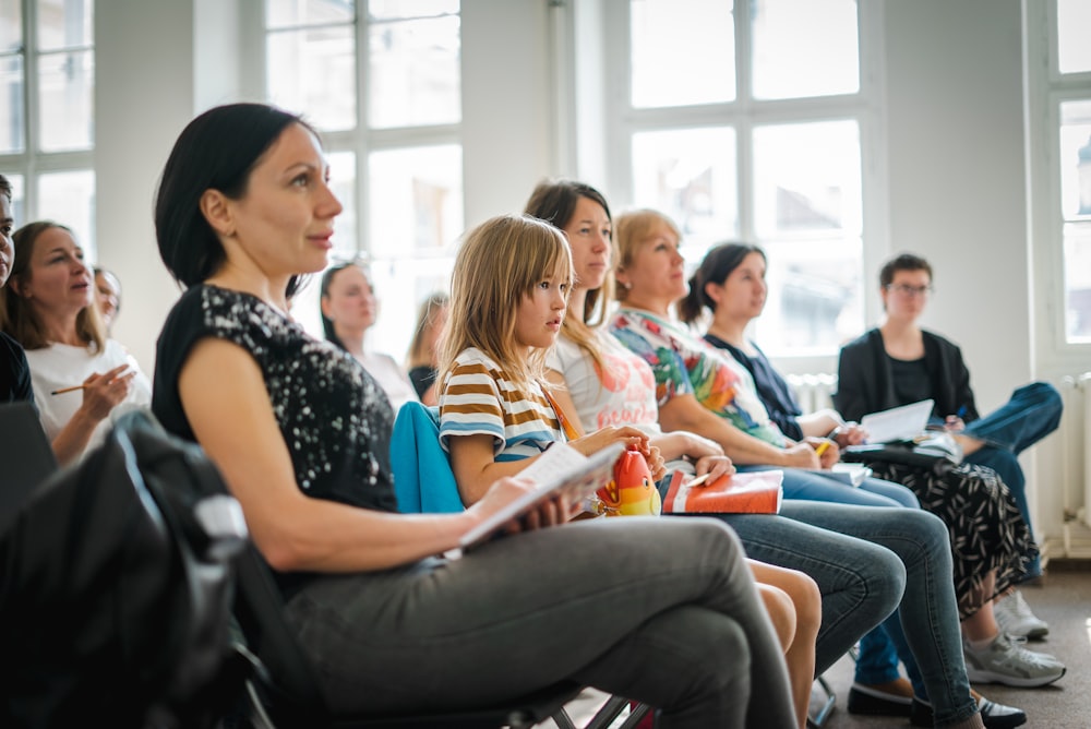 a group of people sitting in a room