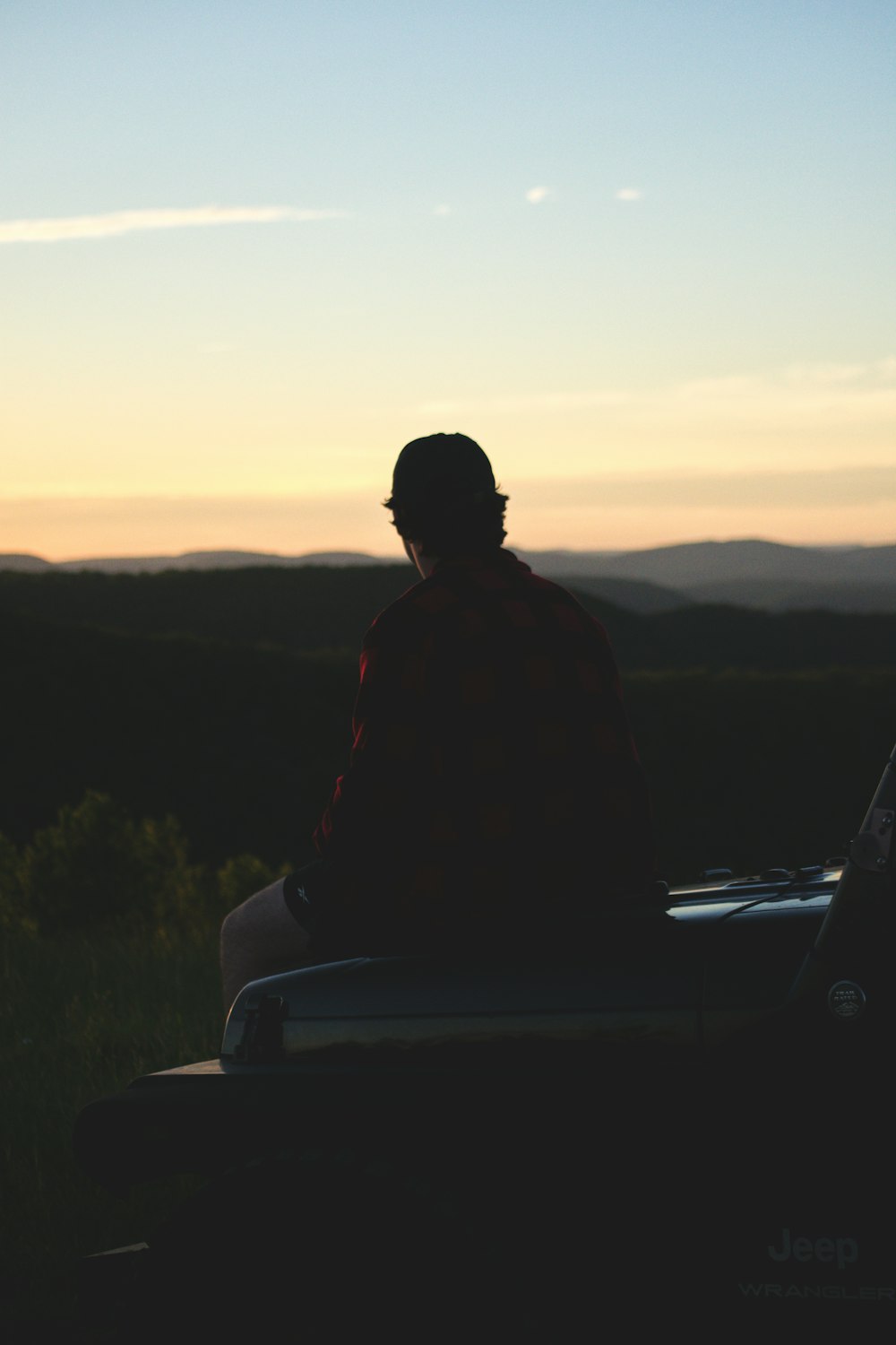 a person sitting on a car