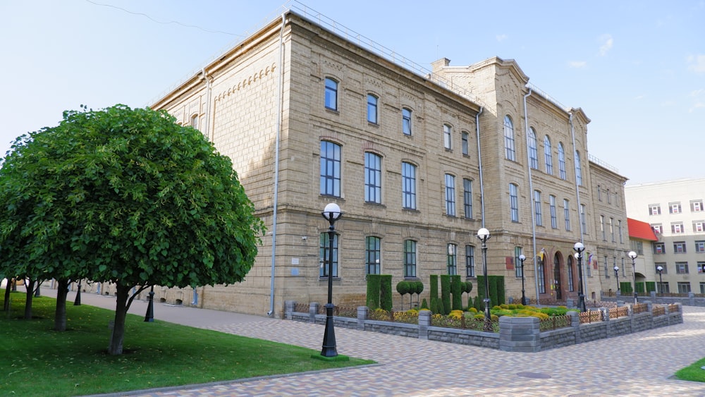 a large building with a tree in front of it