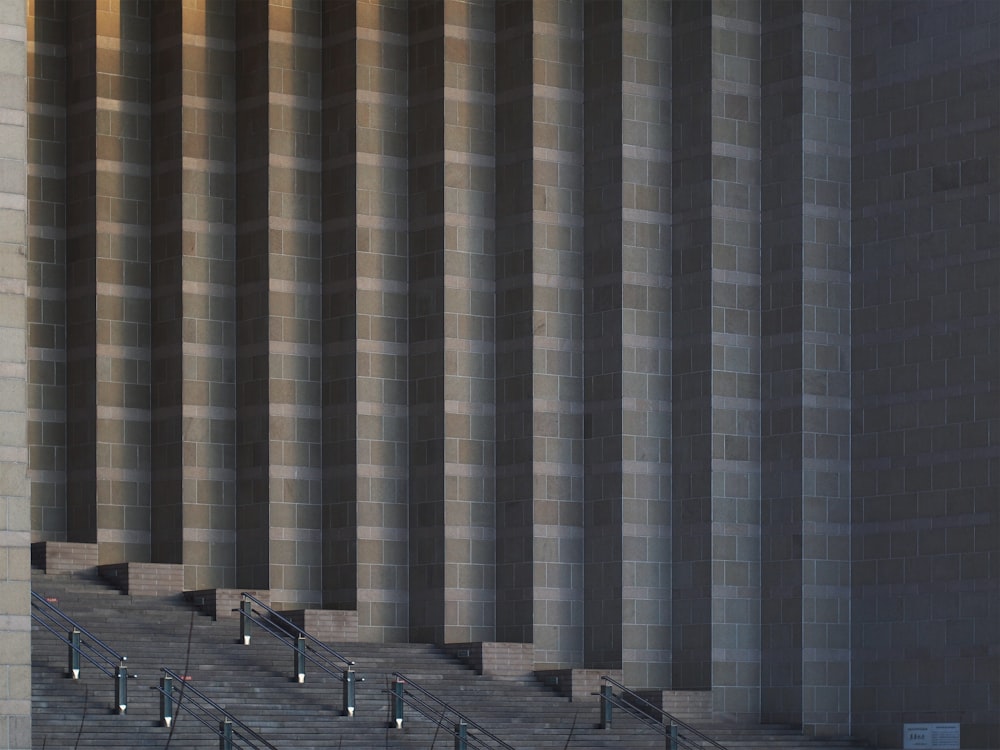 a large grey building with stairs