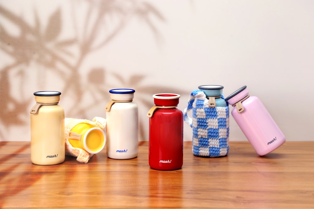 a group of different colored bottles