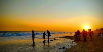 a group of people on a beach