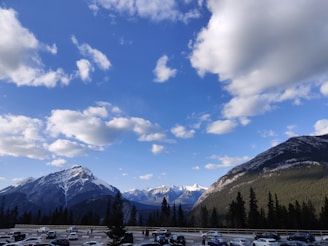 A scenic view of Glacier Park with a taxi parked nearby, showcasing the beautiful landscape.