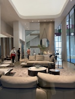 An elegant interior of a spacious living room with stylish furnishings.