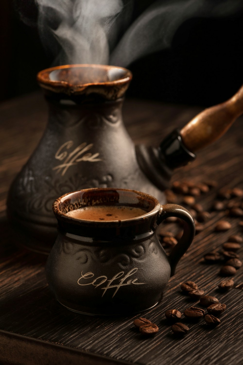 a coffee cup and a mug on a table