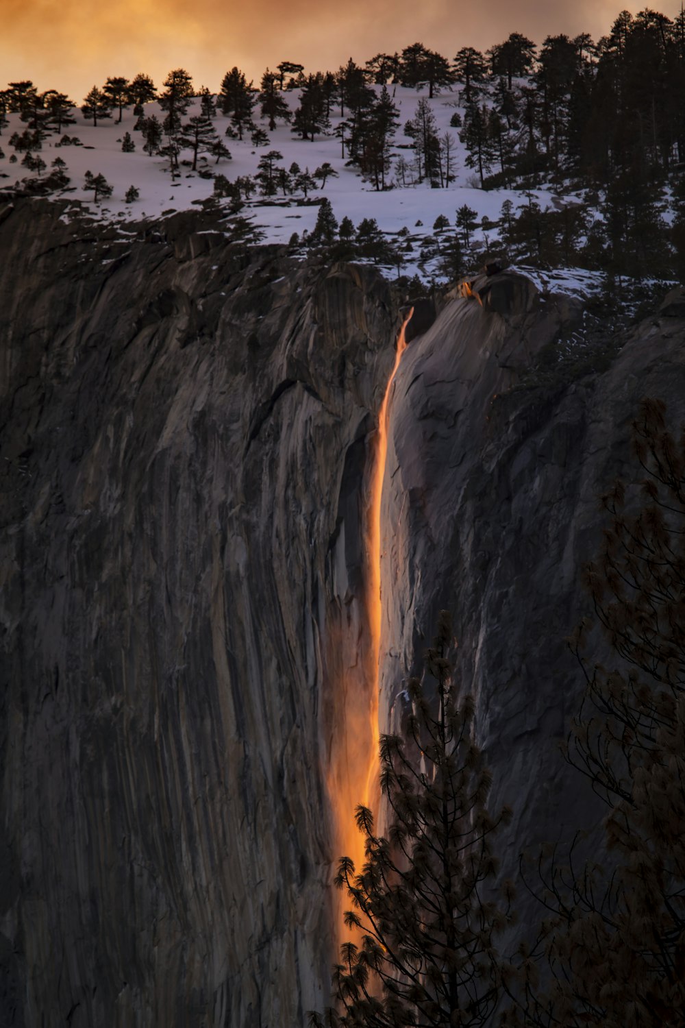 a large waterfall with a river running through it