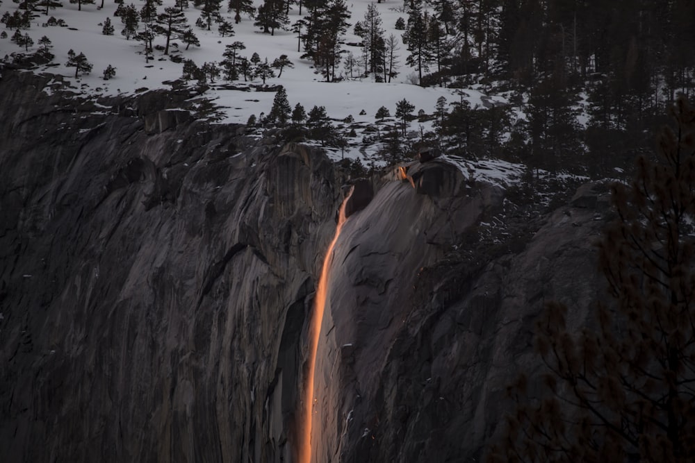 a large rock with a fire in it