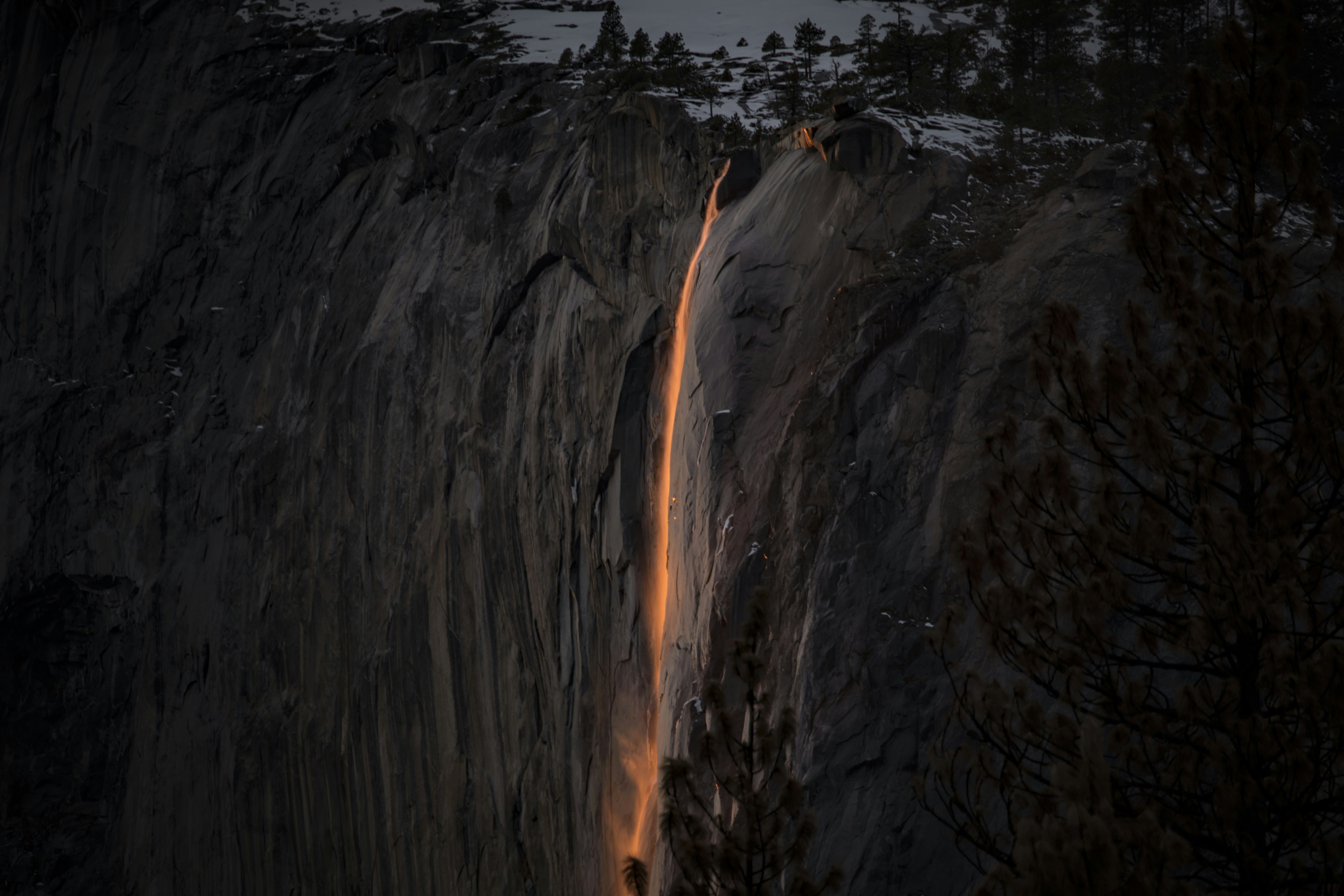 a waterfall in a forest in Yosemite National Park Firefall.