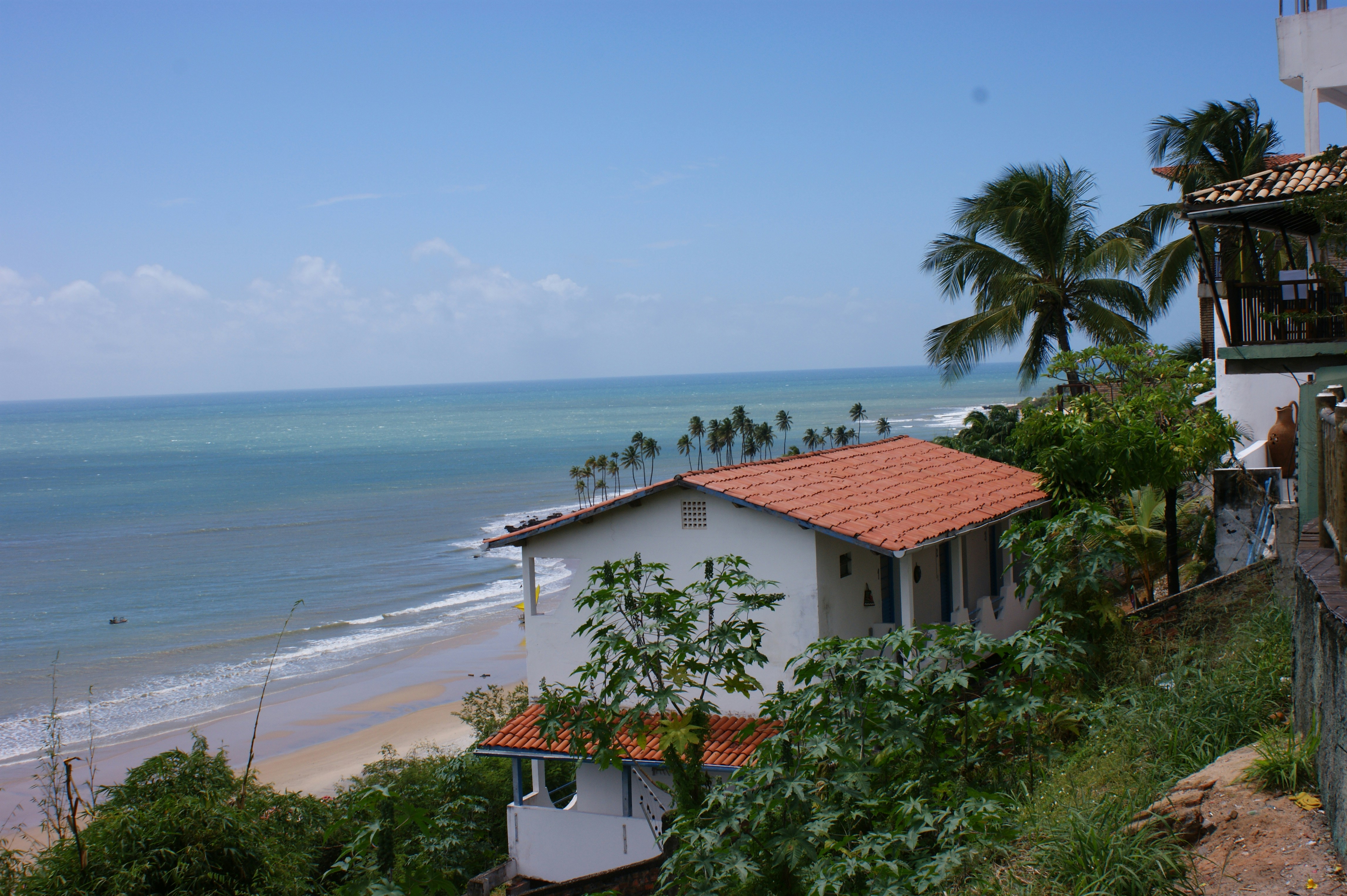 Howe Bay Beach House exterior — private oceanfront retreat with red sand beach and wide ocean views