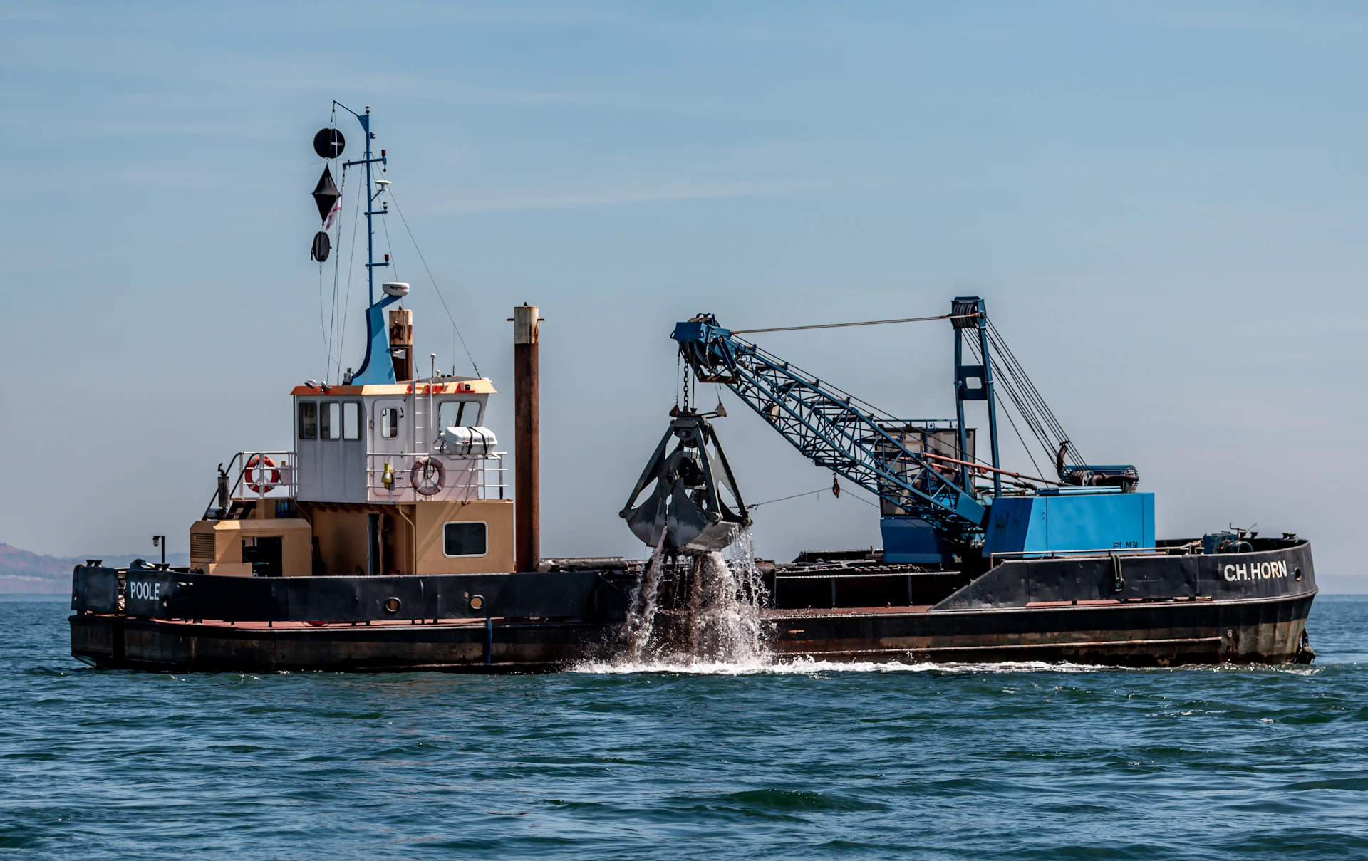 a tugboat pushing a barge