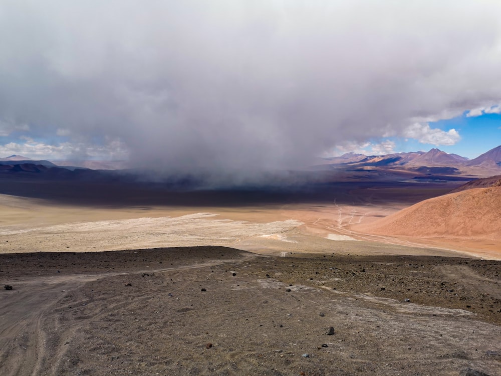 a landscape with hills and clouds