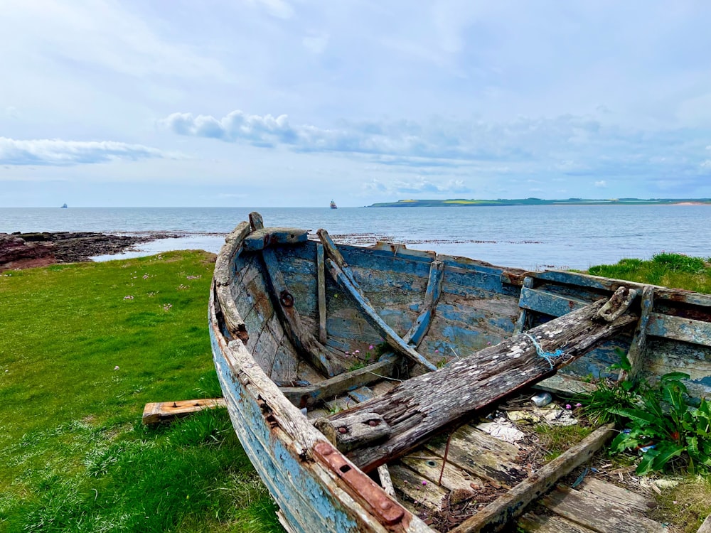 a boat sits on the shore