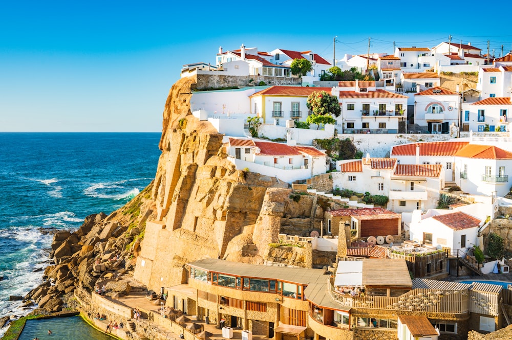 a group of houses on a cliff