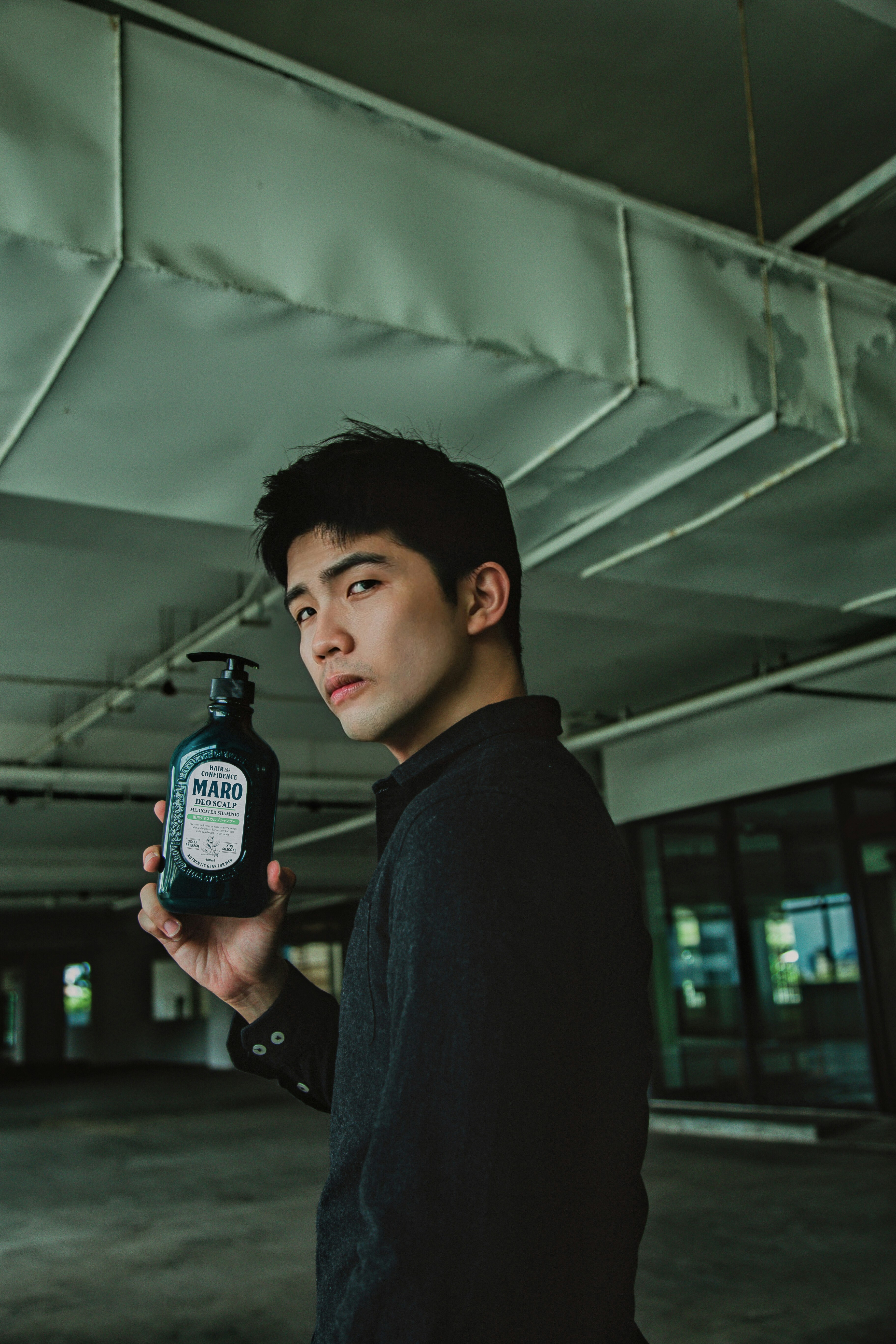 a person holding a bottle