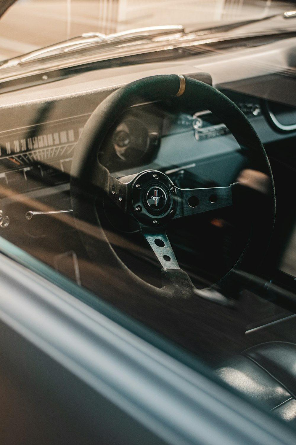 a steering wheel and dashboard of a car